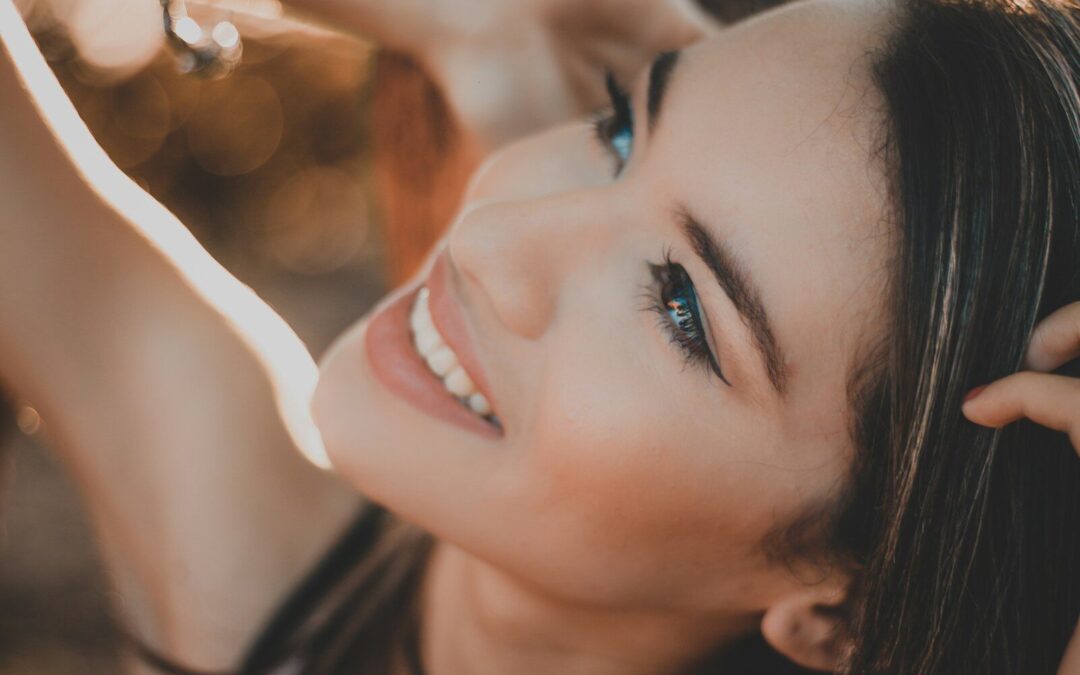 smiling woman with black hair and red lipstick